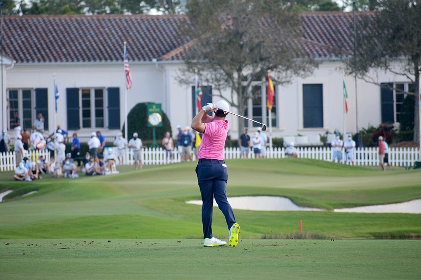 Rory McIlroy hits his second shot on the No. 18 hole at The Concession Golf Club. McIlroy would par the hole to shoot six under par for the round. He is 11 under par overall (T5).