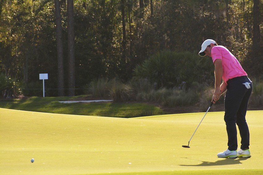 Rory McIlroy putts on the No. 18 hole at The Concession Golf Club. He would par the hole.
