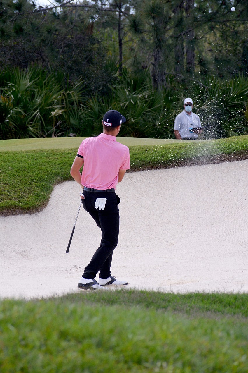 Justin Thomas hits out of a bunker on the No. 12 hole at The Concession Golf Club. Thomas would par the hole. He finished the tournament eight under par.