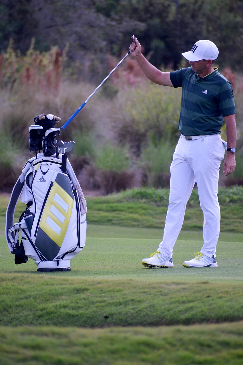 Sergio Garcia throws his club into his golf bag after a shot he didn't like on the No. 12 hole at The Concession Golf Club. Garcia would birdie the hole. He finished the tournament four under par.