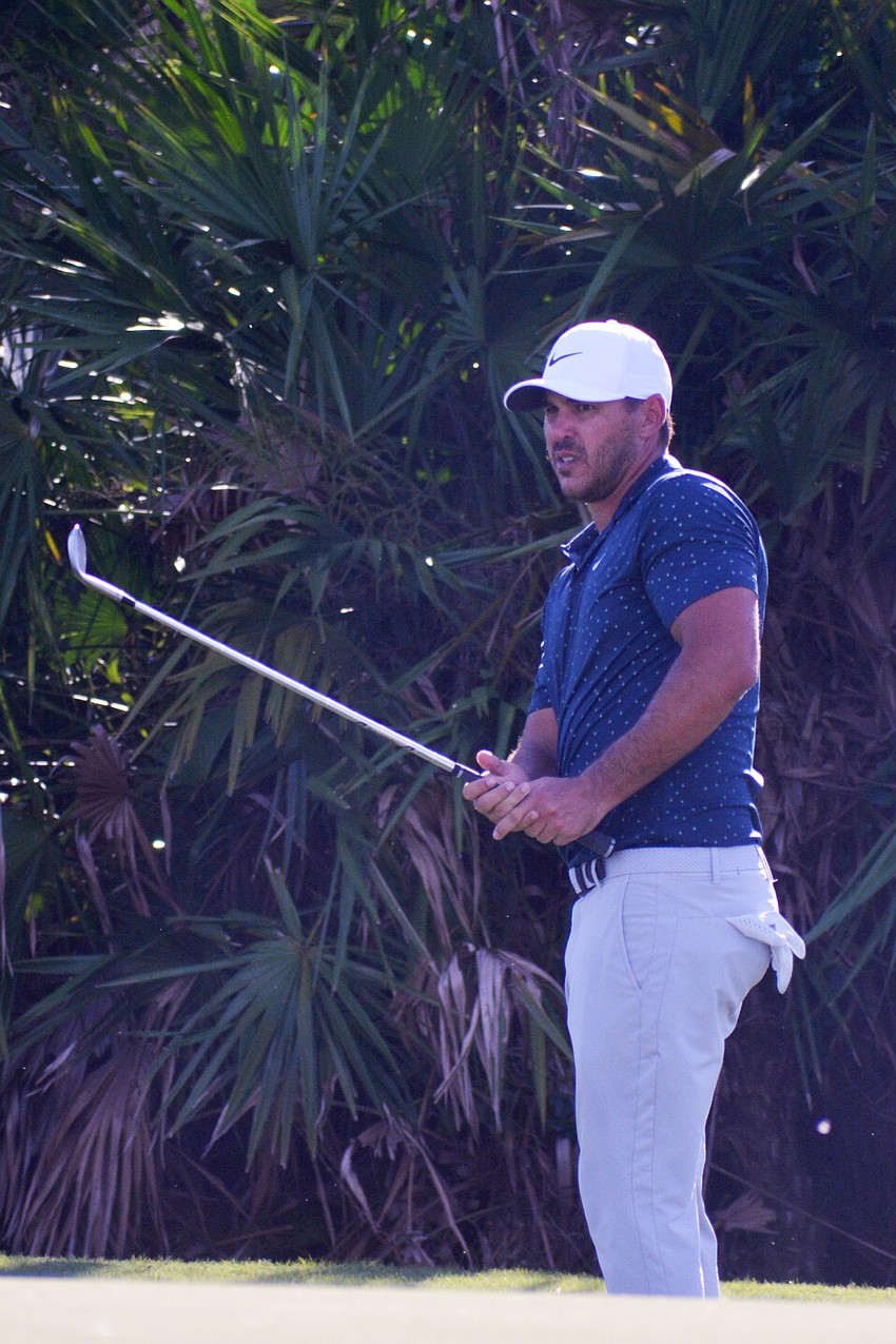 Brooks Koepka watches his chip shot on the No. 12 hole at The Concession Golf Club. Koepka would bogey the hole. He finished the tournament 15 under par (T2).