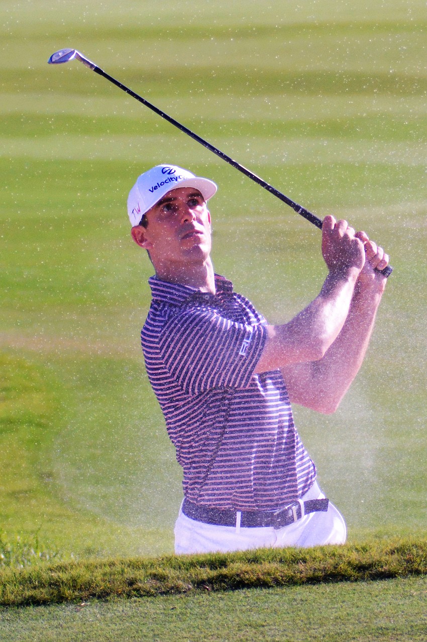 Billy Horschel kicks up sand with his second shot on the No. 12 hole at The Concession Golf Club. Horschel would birdie the hole. He finished the tournament 15 under par (T2).