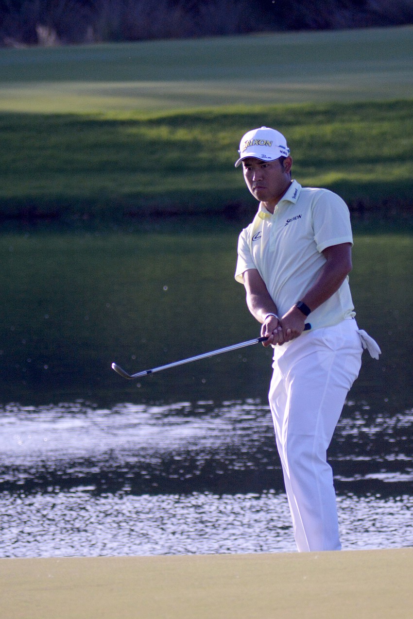 Hideki Matsuyama hits onto the No. 18 green at The Concession Golf Club. Matsuyama would double bogey the hole.
