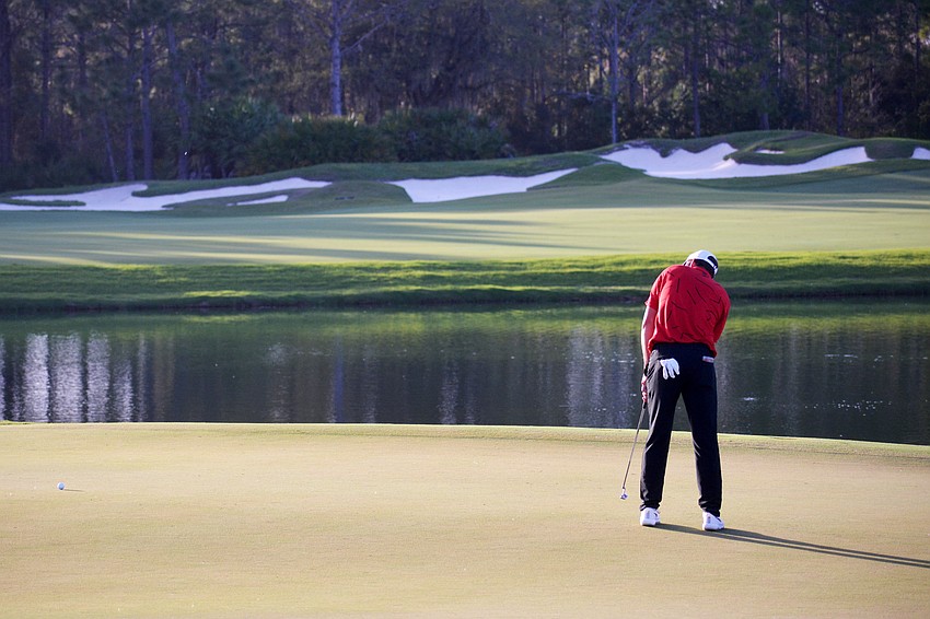 Scottie Scheffler putts on the No. 18 green at The Concession Golf Club. Scheffler would par the hole. He finished the tournament 14 under par (4).