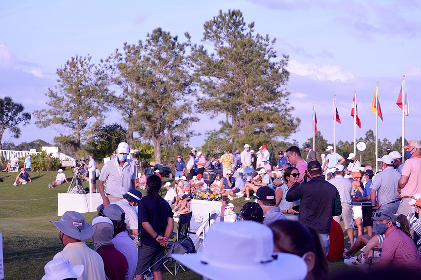 The gallery of Concession members and invited guests on the No. 18 hole was lively.