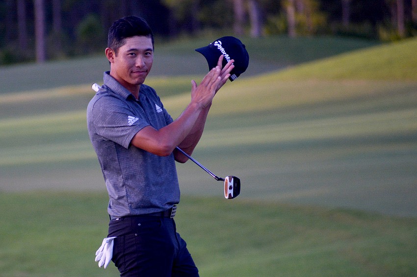 Collin Morikawa claps with the gallery after winning the World Golf Championships-Workday Championship at The Concession.