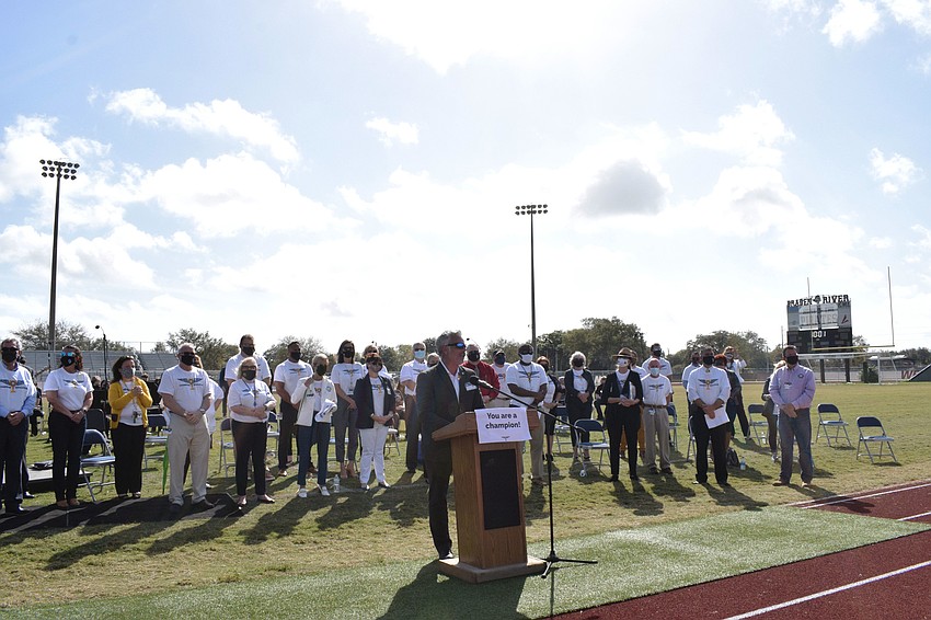 Skip Wilhoit, the safe schools, dropout prevention and student intervention specialist for the district, welcomes employees alongside dozens of district leaders.