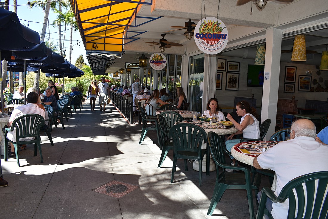 People eat at the Cha Cha Coconuts in St. Armands Circle.