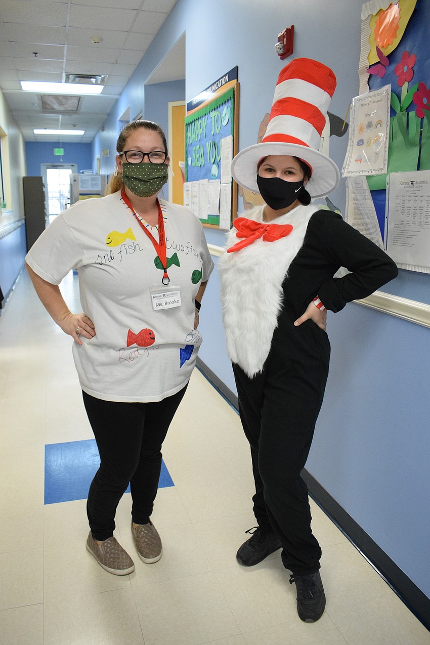 Brooke Williams, an assistant director, and Mariah Esparza, a teacher, celebrate Dr. Seuss' birthday by dressing up.