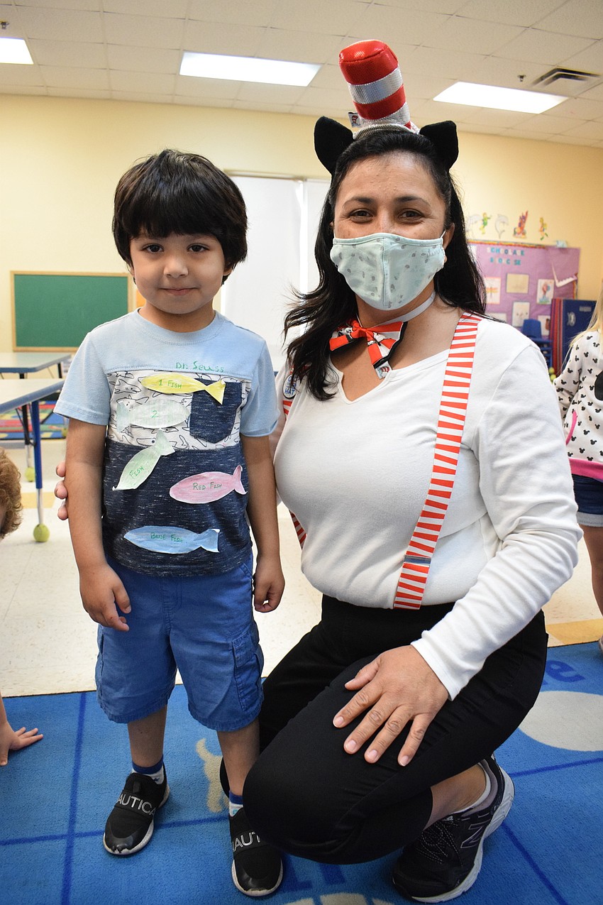Om Pathak and his teacher, Dahlia Olvera, dress as characters from Dr. Seuss books. Pathak has fish on his shirt for 