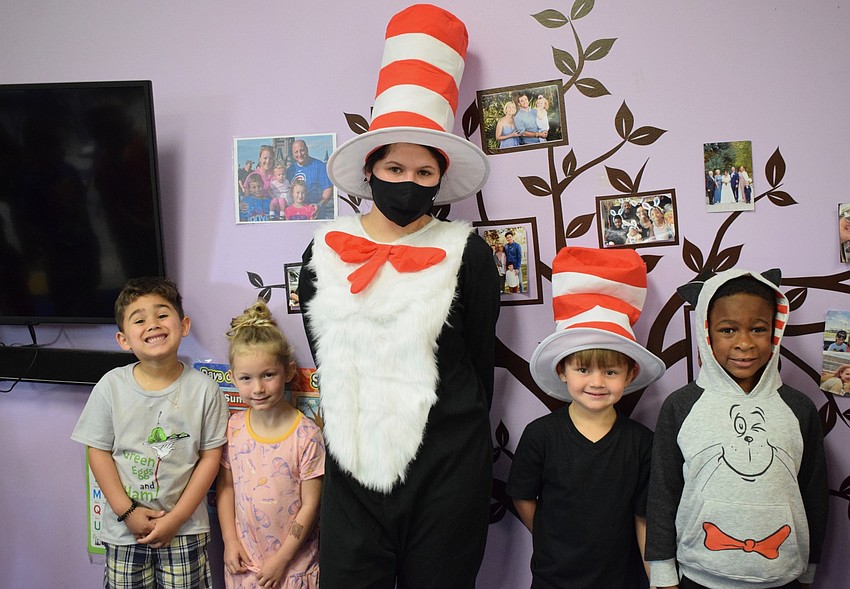 Carter Dominguez, Peyton Williams, Mariah Esparza, Weston Michard and Lawrence James celebrate Dr. Seuss' birthday. They all dressed in clothing showing different characters from Dr. Seuss books.