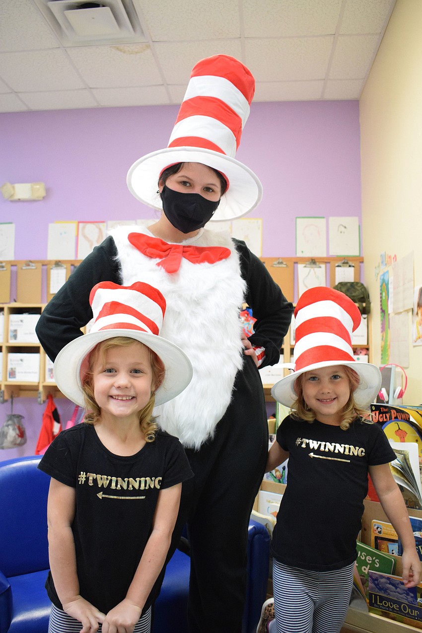 Kinsley Lunde and Addy Lunde are not only twinning with each other, but they're twinning with Mariah Esparza, a teacher.