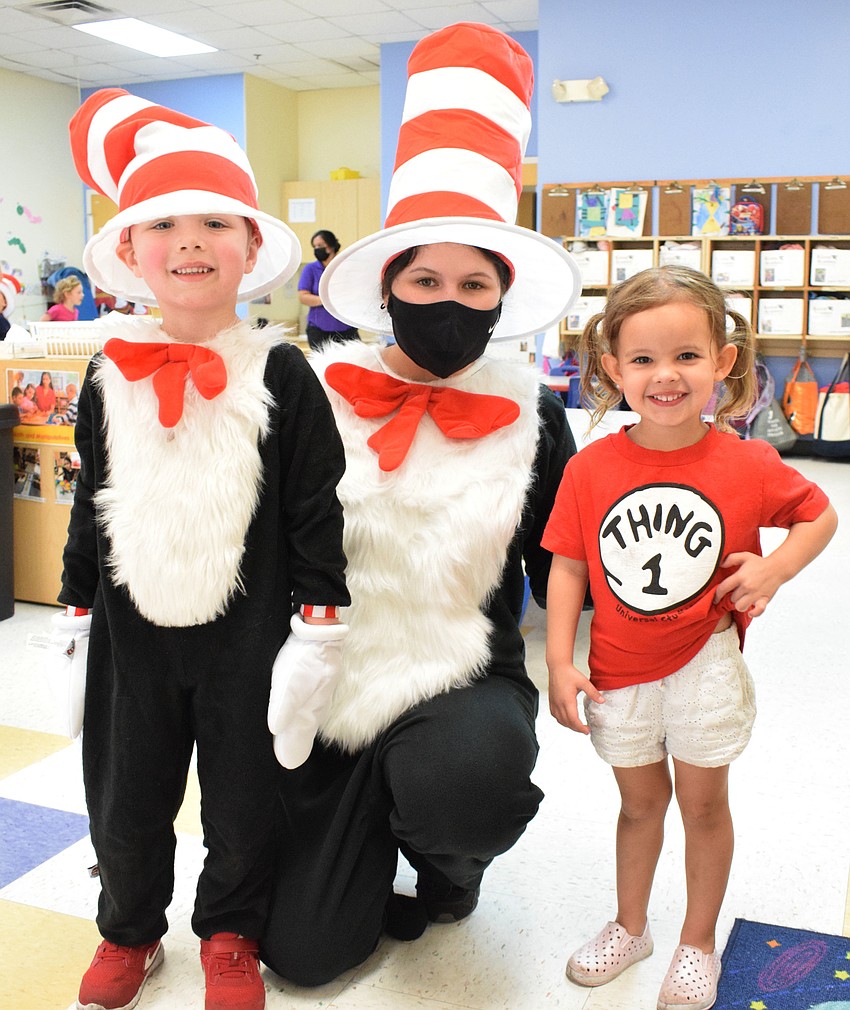 Aiden Osborne dresses just like Mariah Esparza, a teacher who is dressed as the Cat in the Hat, while Alangh Sage dresses as Thing 1. All characters are from Dr. Seuss' 