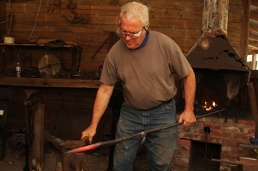 Trez Cole smithed new shapes to an interested crowd.