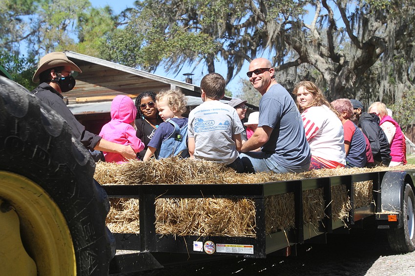 Eric McGrath led people on tractor rides.