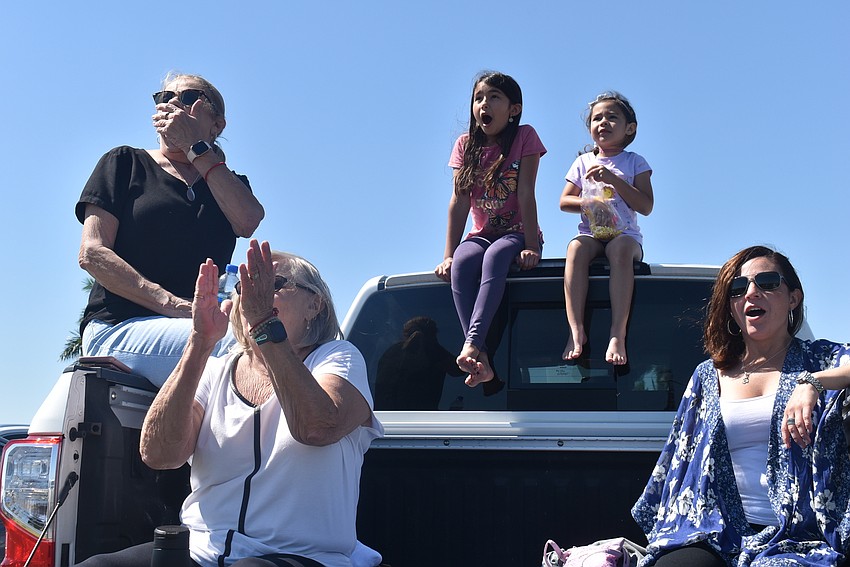 Sarasota residents Brenda Zumbro and Linda Bates and Greenbrook residents Violet Cadavid, 9, Maya Cadavid, 5, and Lili Allen react to a stuntman being launched from a cannon.