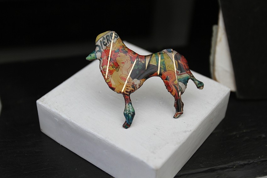 John Crutchfield had a series of small metallic graphic art pieces.