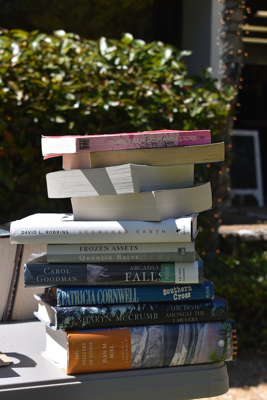 One customer had a hefty stack of books waiting to be purchased as they finished browsing.