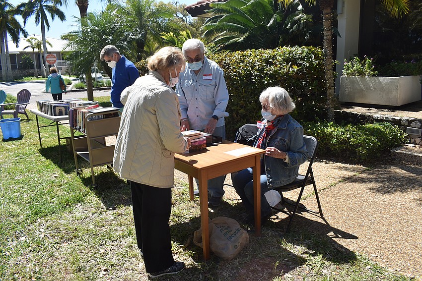 Sue Reese makes her purchases.
