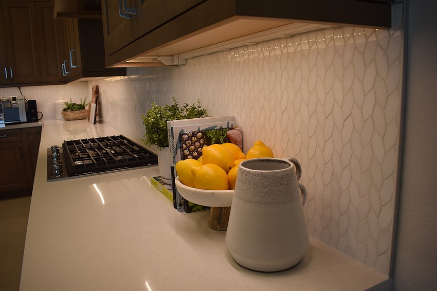The light, clean countertops and backsplashes are a highlight in the Margo kitchen.
