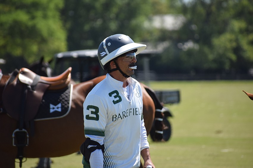 Barefield's Charly Quincoces gets ready to change horses between chukkas.