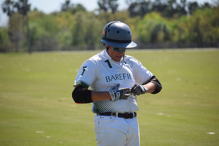 Mark Mulligan of Barefield adjusts his equipment between chukkas.