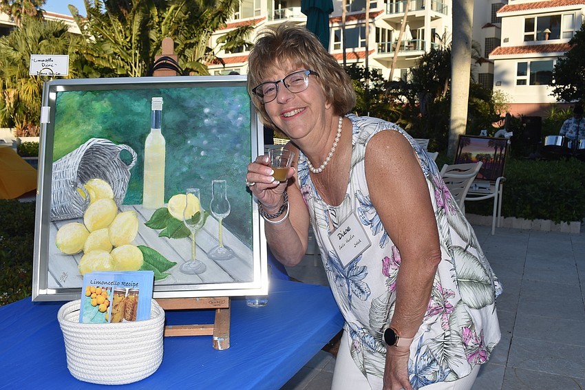 Diane Gallo Van Ess with her lemon painting and homemade limoncello.
