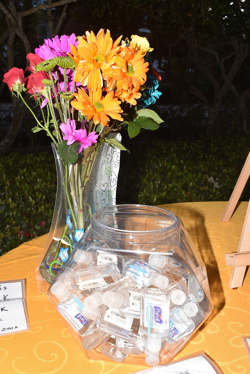 Hand sanitizers were offered at the welcome table.