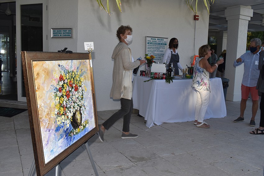 Paintings were propped up around the pool area.