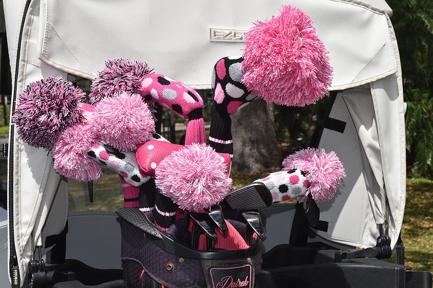 Golfers decked out their carts and clubs in pink for the occasion.