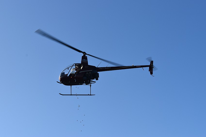 The day started with a helicopter ball drop.