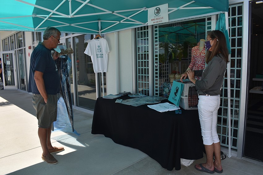 David Harris listens to the Save Our Seabirds mission as told by Cyndi Seamon.