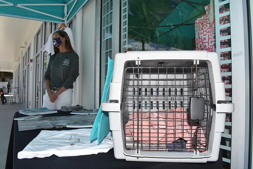 Cyndi Seamon answers questions sparked by the empty pet carrier on the table.