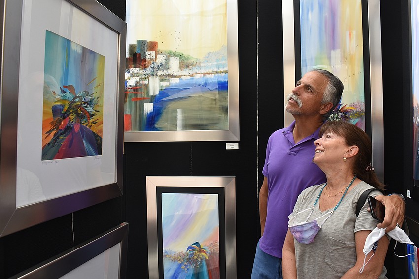 Stephen and Jenie Einstein moved to Esplanade from New Jersey in January. They were drawn in by the vibrant colors at the Belisario Artist exhibit.