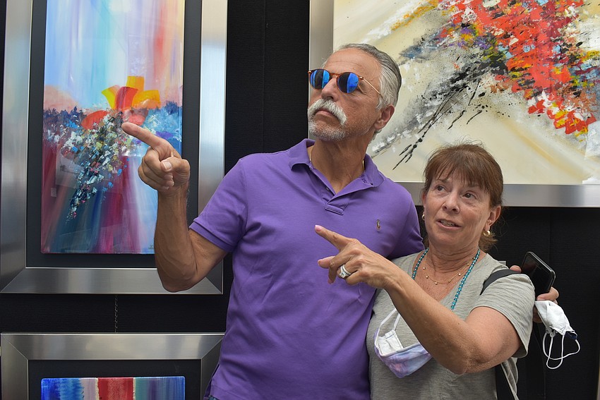 Stephen and Jenie Einstein moved to Esplanade from New Jersey in January. They were drawn in by the vibrant colors at the Belisario Artist exhibit.