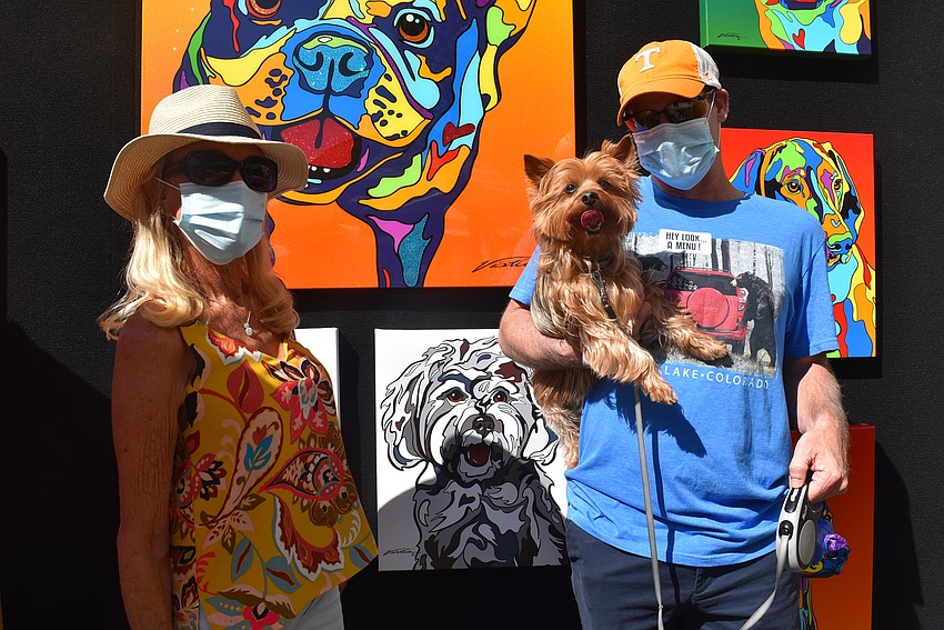 Country Club resident Debbie Pickett and her son, Jim Stark, hold 10-year-old silky terrier Bojangles, also known as 
