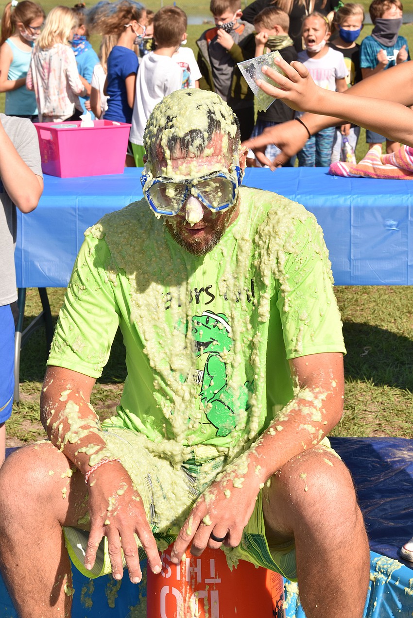 Todd Richardson, the principal, sits as slime oozes down his clothes. Courtesy photo.