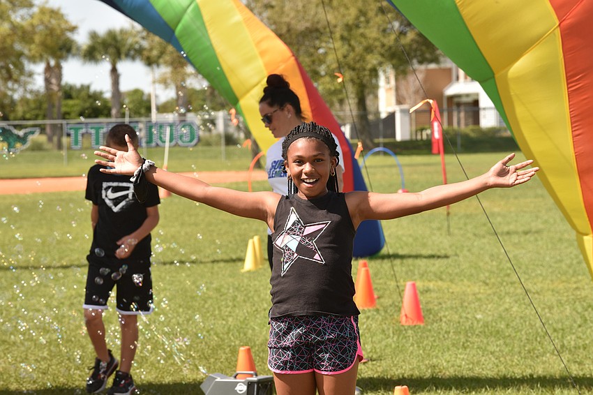 Fourth grader Jaliyah Smith enjoys time outside during the walk-a-thon.