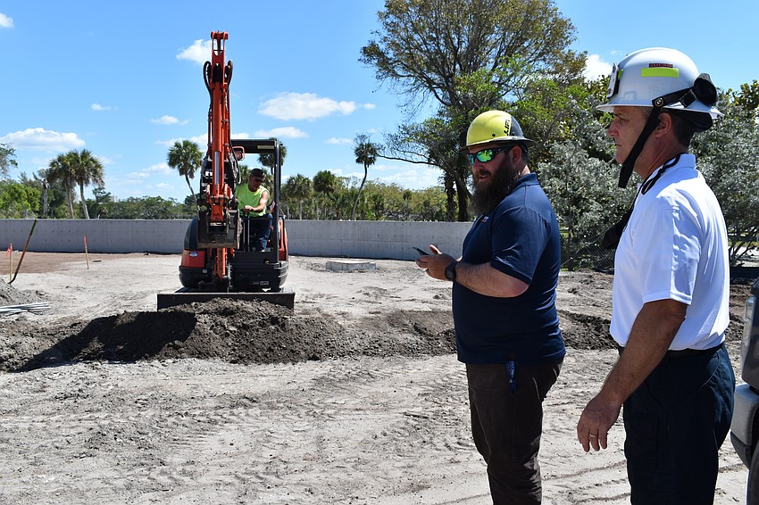 Jon F. Swift Construction superintendent Shane Hamm and Fire Chief Paul Dezzi view the Fire Station 92 construction site at 2162 Gulf of Mexico Drive.