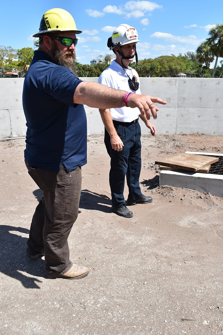 Jon F. Swift Construction superintendent Shane Hamm and Fire Chief Paul Dezzi view the Fire Station 92 construction site at 2162 Gulf of Mexico Drive.