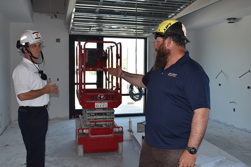 Jon F. Swift Construction superintendent Shane Hamm and Fire Chief Paul Dezzi discuss what the new kitchen area will look like inside of Fire Station 92.