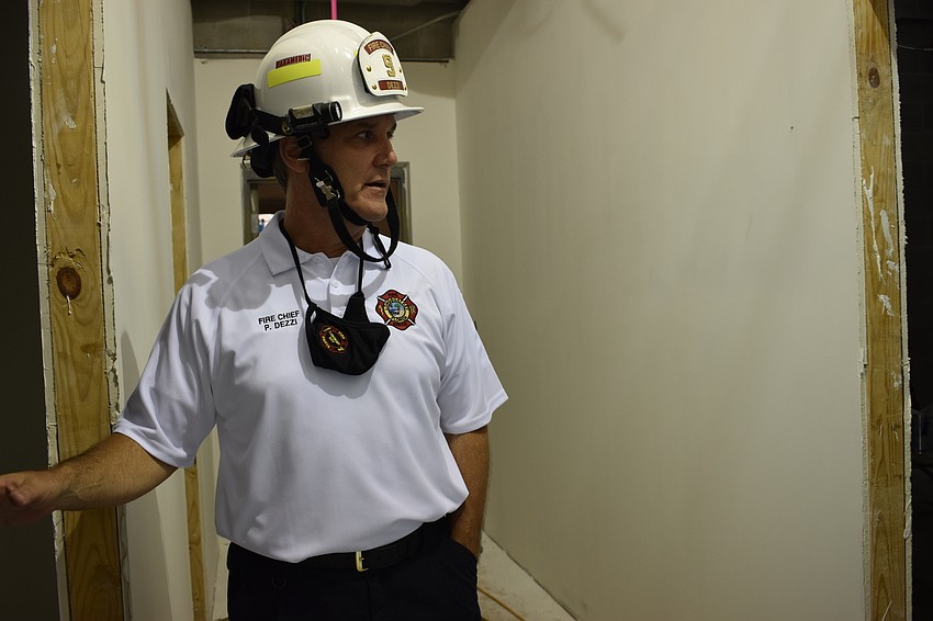 Fire Chief Paul Dezzi looks over the construction inside of Fire Station 92, which is set to open in May.