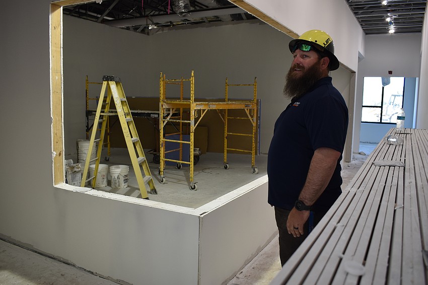 Jon F. Swift Construction superintendent Shane Hamm shows where the Fire Station 92’s indoor gym will be located.
