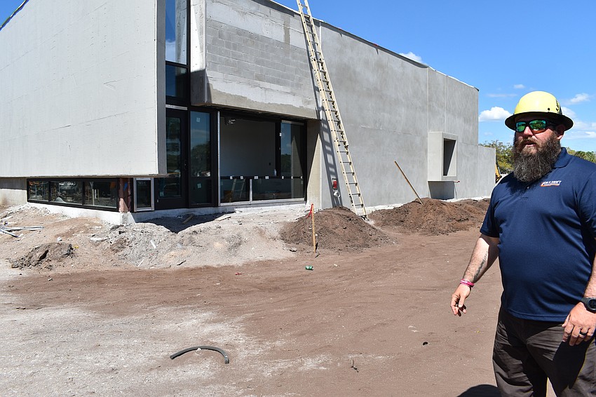 Jon F. Swift Construction superintendent Shane Hamm demonstrates how the entrance for Fire Station 92 will be on the south side of the building.