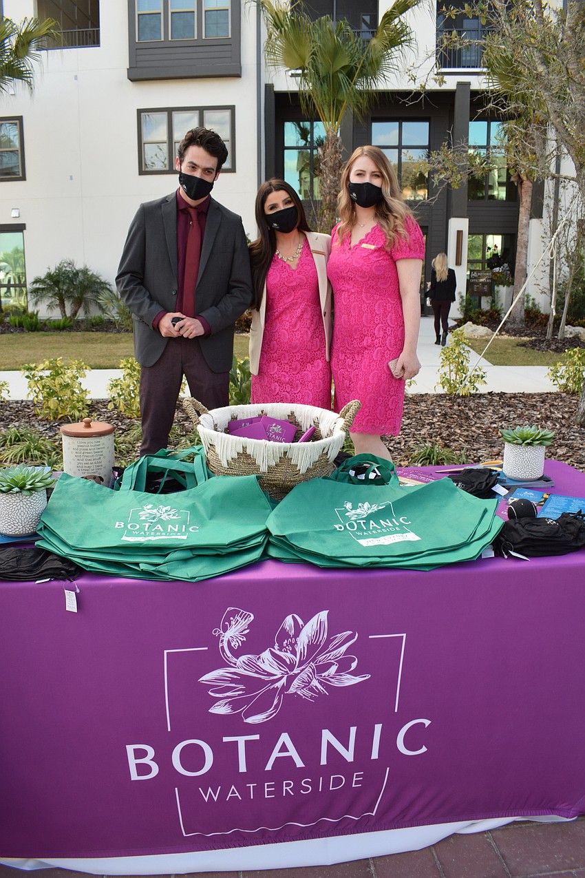 Botanic Waterside Groundskeeper Ben Davis, Leasing Professional Sarah Robertson and Assistant Manager Caitlin Gregory celebrate the grand opening of the apartment complex. Botanic Waterside has 320 apartments.