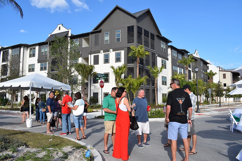 People celebrate the grand opening of Botanic Waterside.