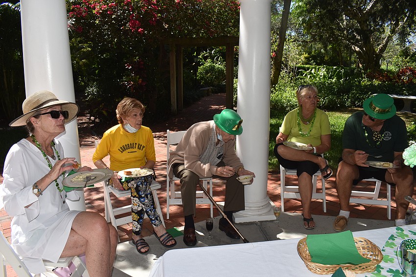 Attendees mingled in the garden as they served up seconds.
