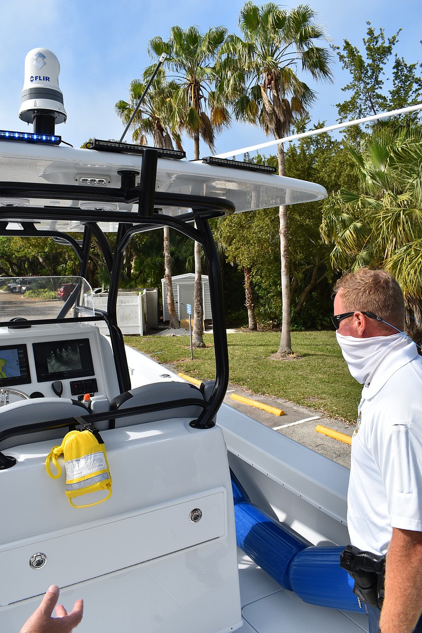 Marine patrol officer Joshua Connors demonstrates how the Garmin radar Forward Looking InfraRed camera system works.