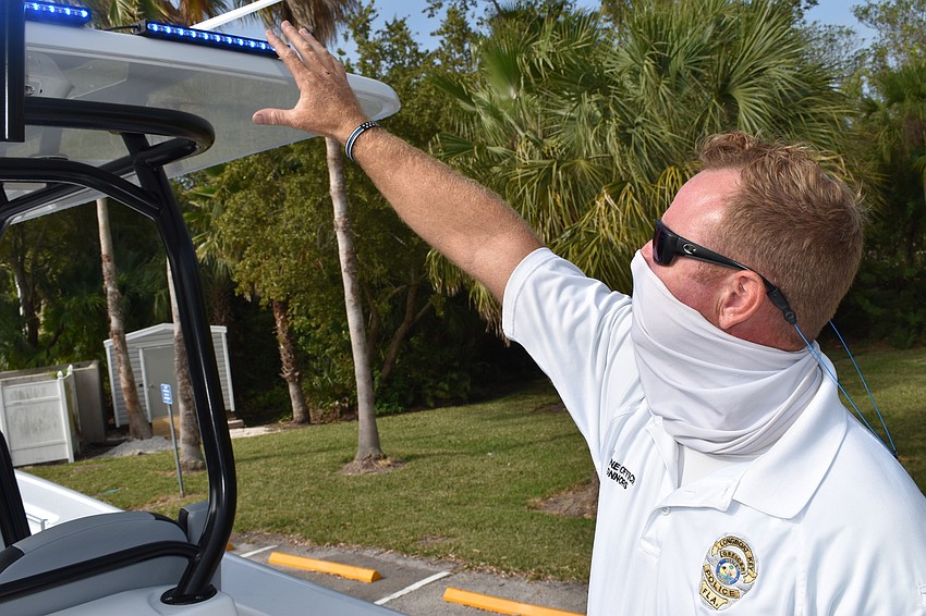 Marine patrol officer Joshua Connors demonstrates how the Garmin radar Forward Looking InfraRed camera system works.