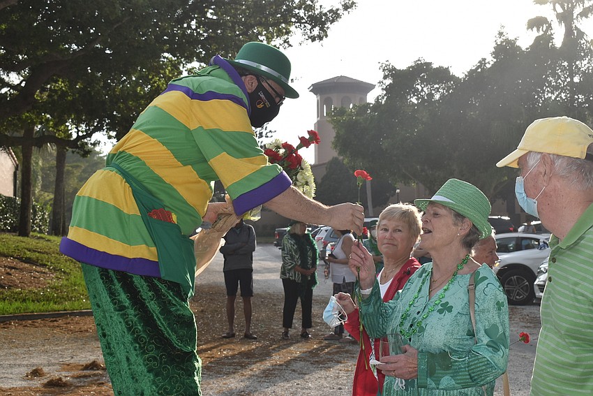 Aaron Watkins gives Deirdre Watkins a flower.